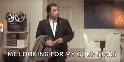 Man In Suit Looking For Gold Stars GIF
