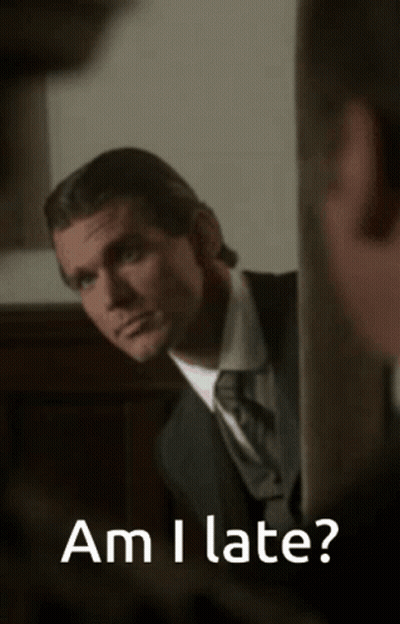 Man In Suit Looking In Mirror Saying Am I Late GIF