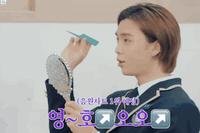 Man In Suit Looking In Mirror With Chinese Writing GIF