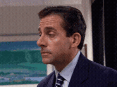 Man In Suit Looking Left GIF