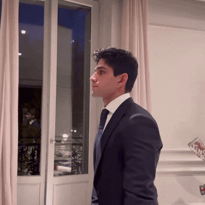 Man In Suit Looking Out Window GIF