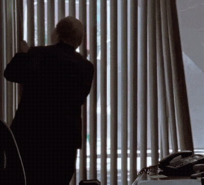 Man In Suit Looking Out Window GIF