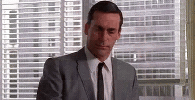 Man In Suit Looking Out Window GIF