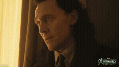 Man In Suit Looking Out Window With Avengers Roomday Poster GIF