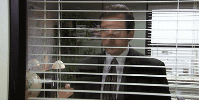 Man In Suit Looking Through Blinds GIF