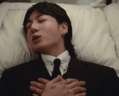 Man In Suit Lying In Coffin GIF