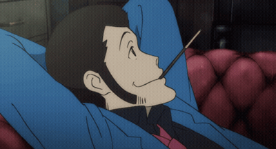 Man In Suit Lying On Couch Eating Stick GIF