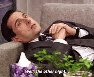 Man In Suit Lying On Couch Saying Well GIF