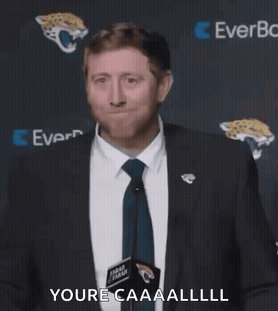 Man In Suit Making Face At Microphone GIF