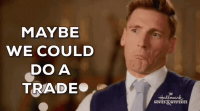 Man In Suit Making Face Saying Maybe We Could Do A Trade GIF