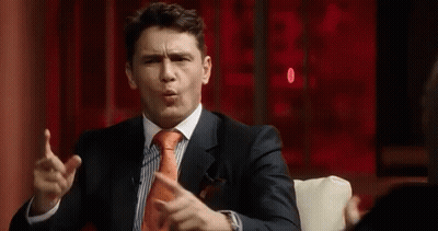 Man In Suit Making Funny Face GIF