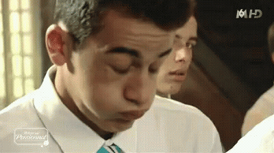 Man In Suit Making Funny Face GIF
