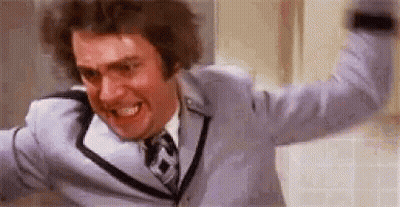Man In Suit Making Funny Face Arms Outstretched GIF