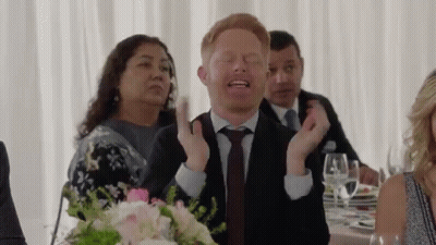 Man In Suit Making Funny Face At Wedding GIF