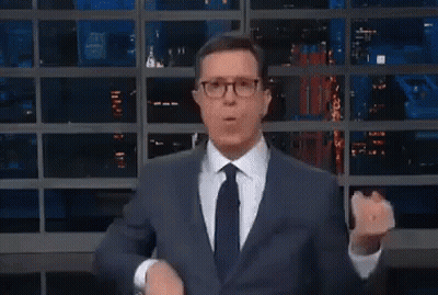 Man In Suit Making Funny Face At Window GIF