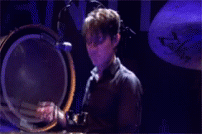 Man In Suit Making Funny Face Before Skyline GIF