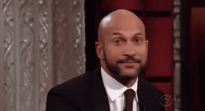 Man In Suit Making Funny Face GIF