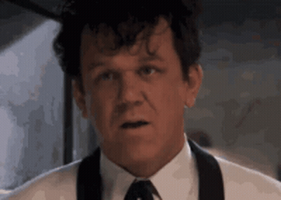 Man In Suit Making Funny Face GIF
