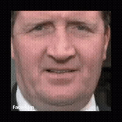 Man In Suit Making Funny Face GIF