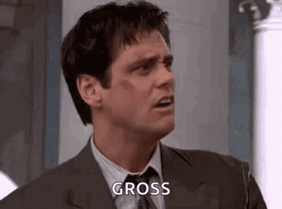 Man In Suit Making Funny Face Gross GIF
