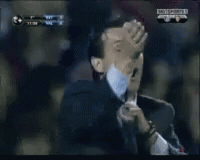 Man In Suit Making Funny Face In Crowd GIF