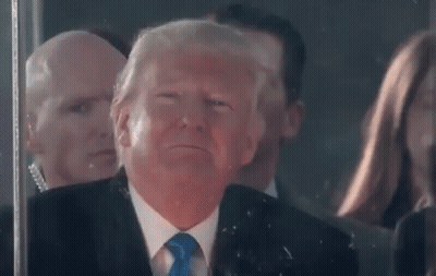 Man In Suit Making Funny Face In Front Of Crowd GIF