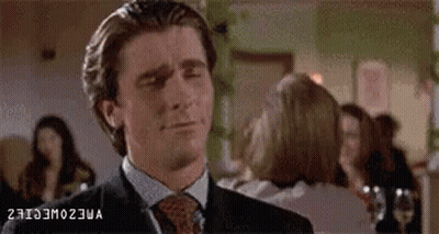 Man In Suit Making Funny Face In Front Of Crowd GIF
