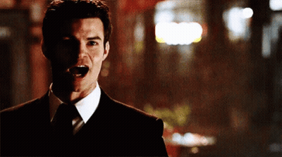 Man In Suit Making Funny Face GIF
