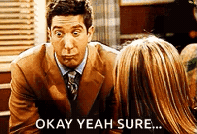 Man In Suit Making Funny Face Next To Woman GIF