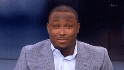 Man In Suit Making Funny Face On TV Show GIF
