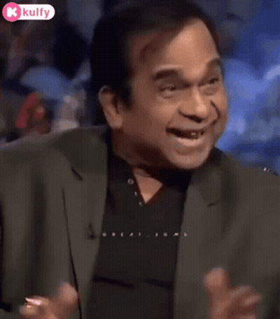Man In Suit Making Funny Face On TV Show GIF