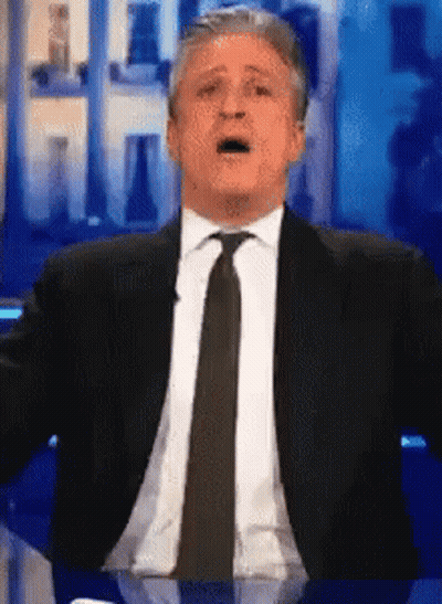 Man In Suit Making Funny Face GIF