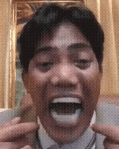 Man In Suit Making Funny Face GIF