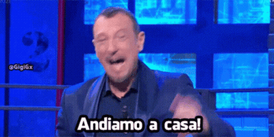 Man In Suit Making Funny Face Saying Andiamo A Casa GIF