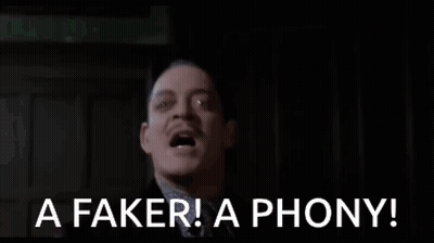Man In Suit Making Funny Face Saying Faker GIF