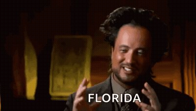 Man In Suit Making Funny Face Saying Florida GIF