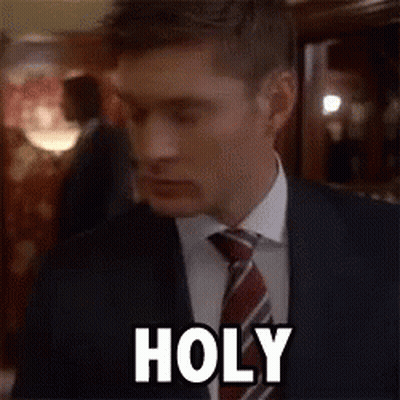 Man In Suit Making Funny Face Saying Holy GIF