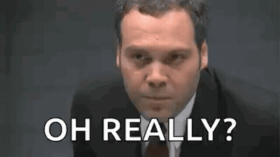 Man In Suit Making Funny Face Saying Oh Really GIF