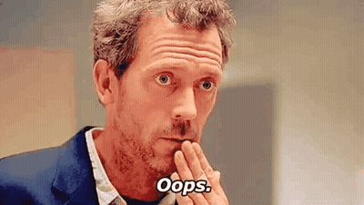 Man In Suit Making Funny Face Saying Oops GIF