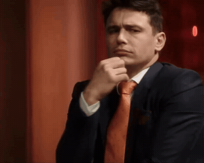 Man In Suit Making Funny Face GIF