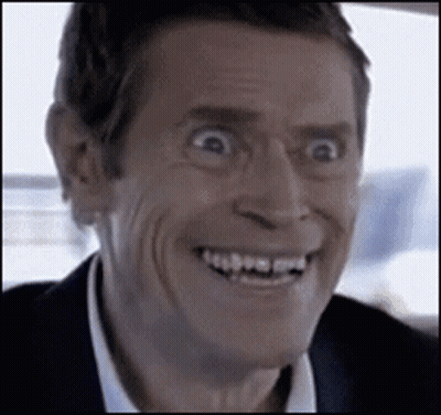 Man In Suit Making Funny Face Smiling GIF