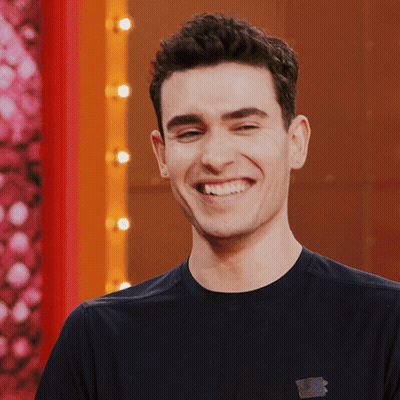 Man In Suit Making Funny Face Smiling GIF