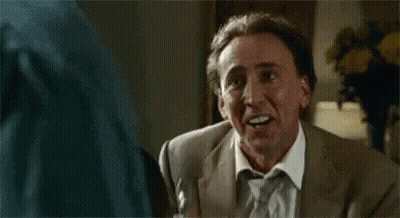 Man In Suit Making Funny Face Talking To Another Man GIF