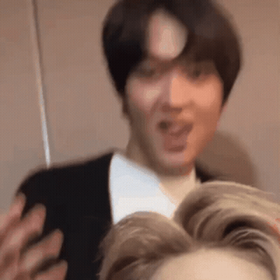 Man In Suit Making Funny Face Talking To Another Man GIF