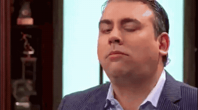 Man In Suit Making Funny Face GIF