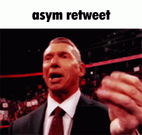 Man In Suit Making Funny Face With Asym Retweet GIF