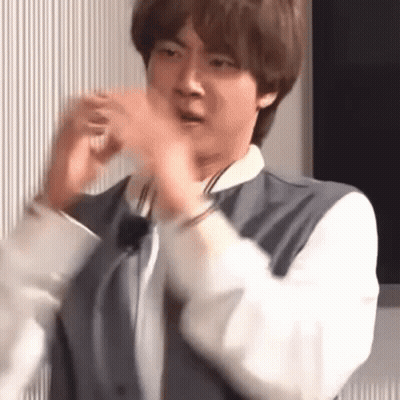 Man In Suit Making Funny Face With Hands GIF