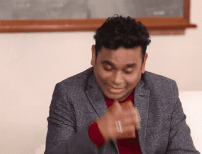 Man In Suit Making Funny Face With Hands GIF