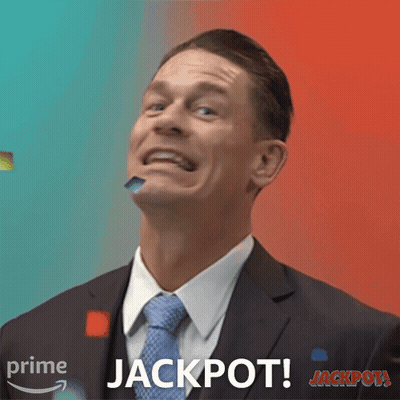 Man In Suit Making Funny Face With Jackpot Behind Him GIF