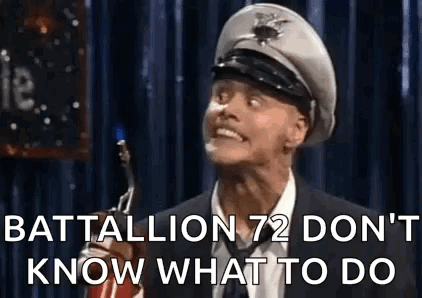 Man In Suit Making Funny Face With Military Hat GIF
